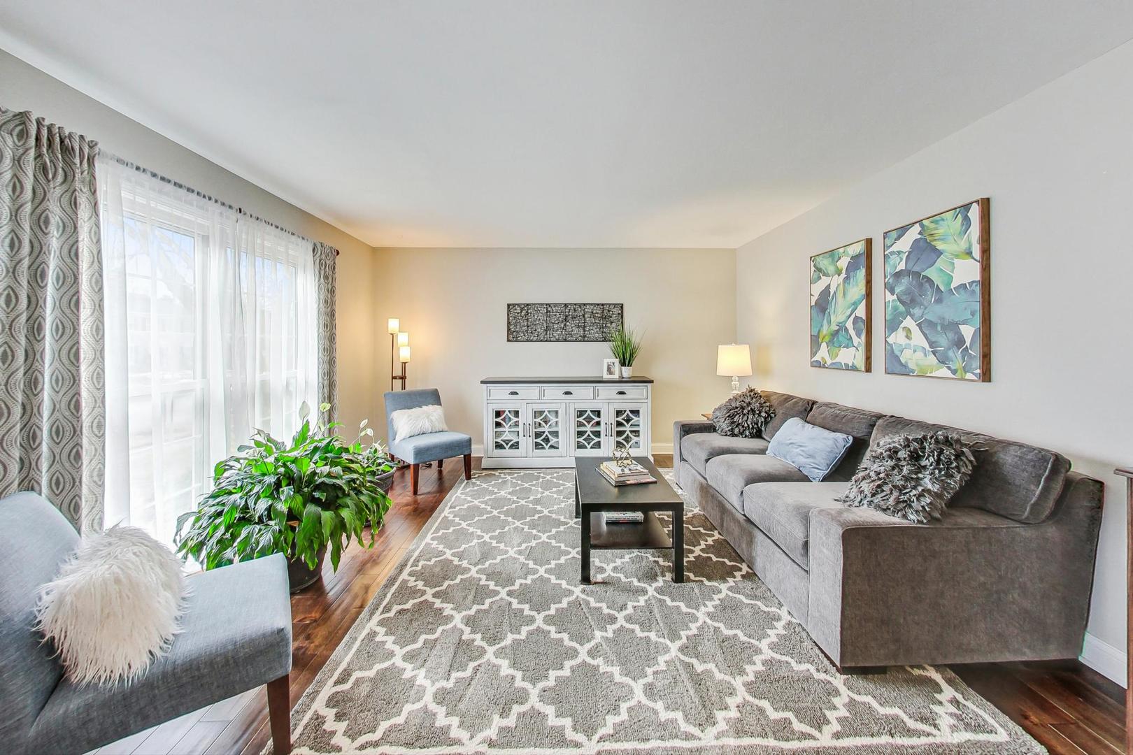 1345 East Bailey Road Naperville, IL 60565 - Photo 3 of 49 a living room with furniture and a potted plant