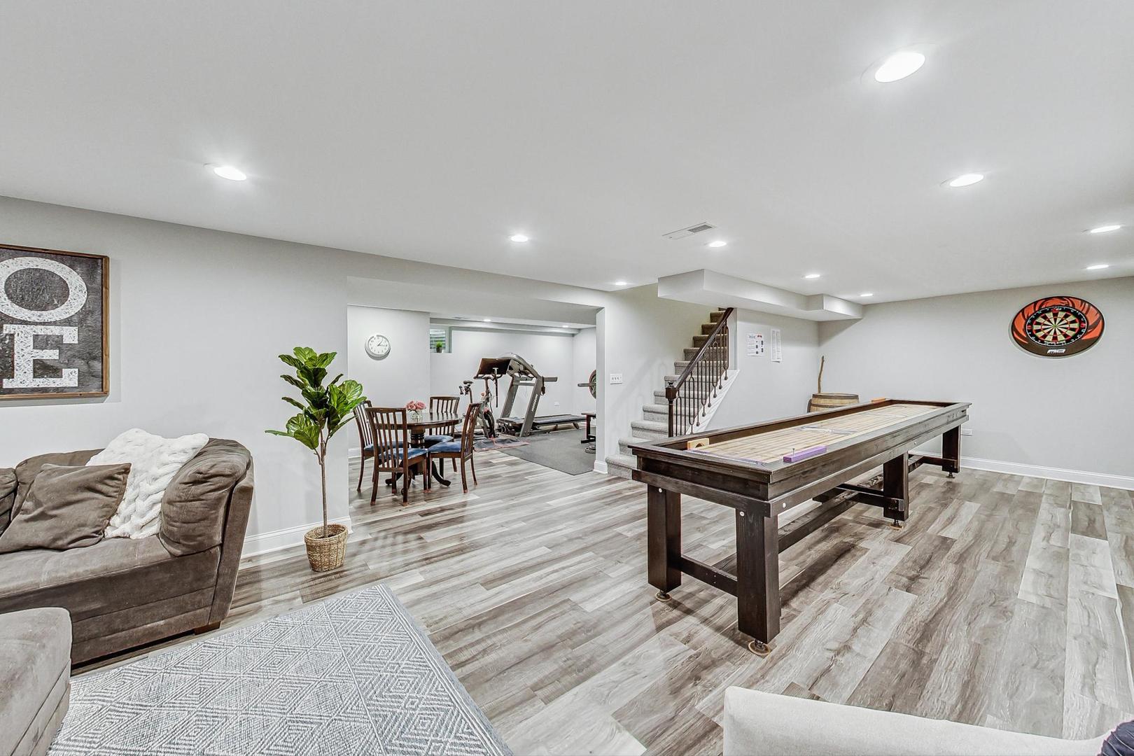1345 East Bailey Road Naperville, IL 60565 - Photo 31 of 49 a living room with furniture and wooden floor