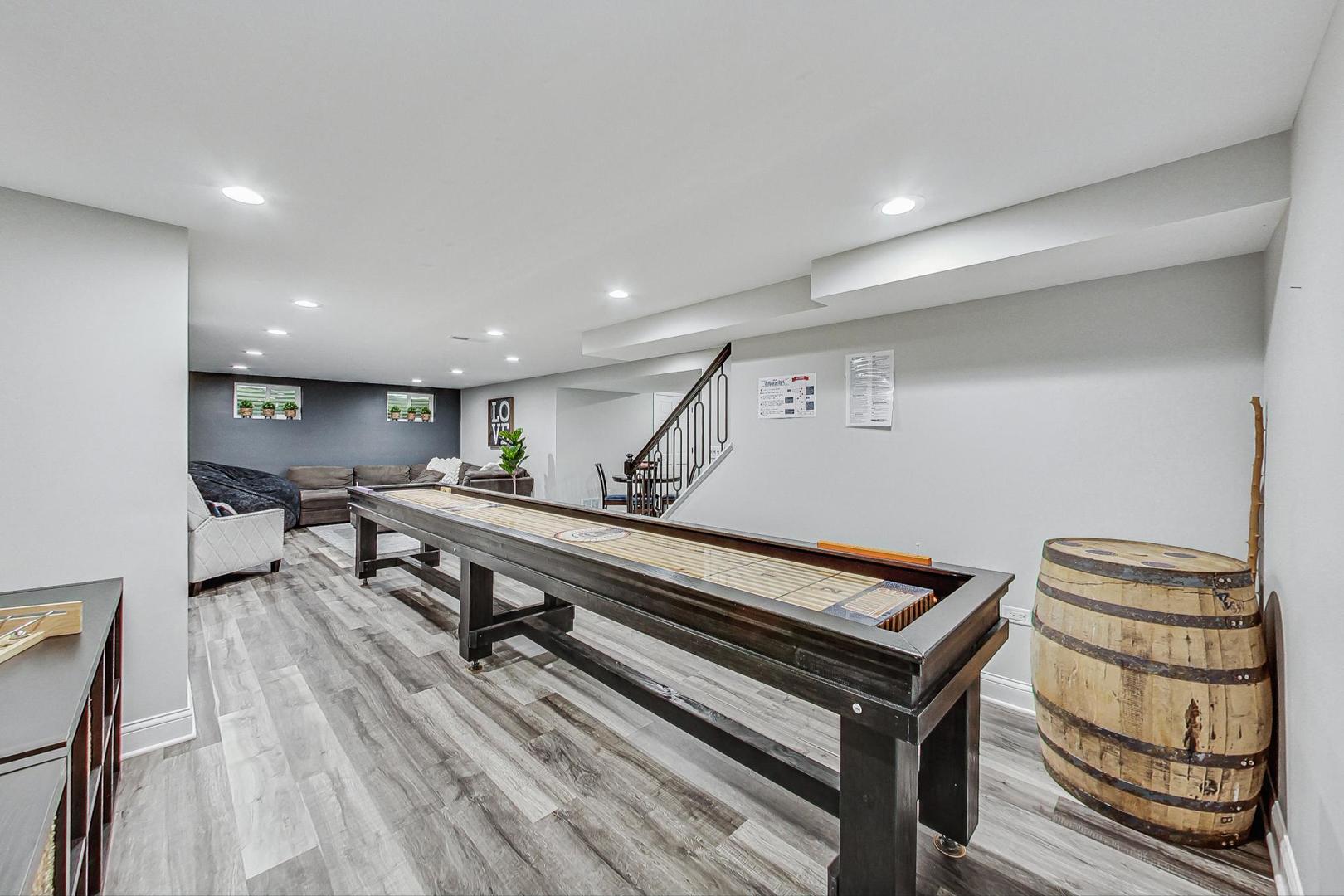1345 East Bailey Road Naperville, IL 60565 - Photo 33 of 49 a living room with furniture a wooden floor and potted plant