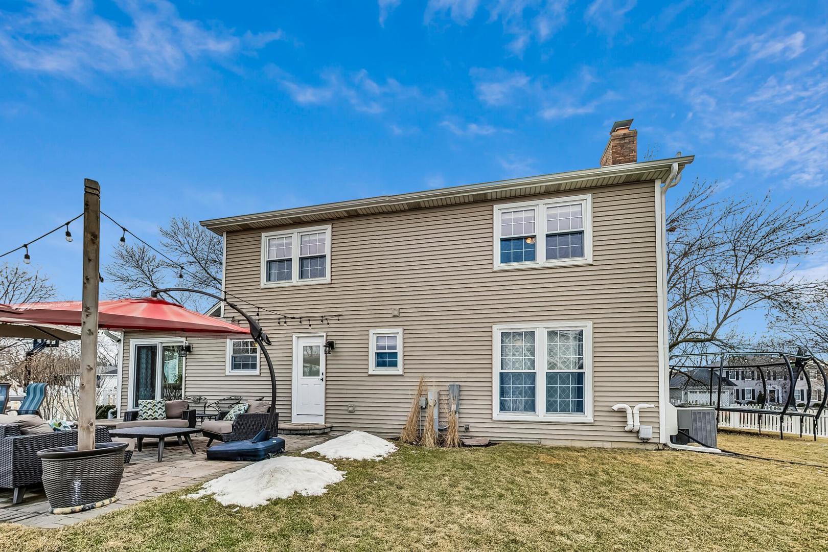 1345 East Bailey Road Naperville, IL 60565 - Photo 35 of 49 a front view of a house with swimming pool