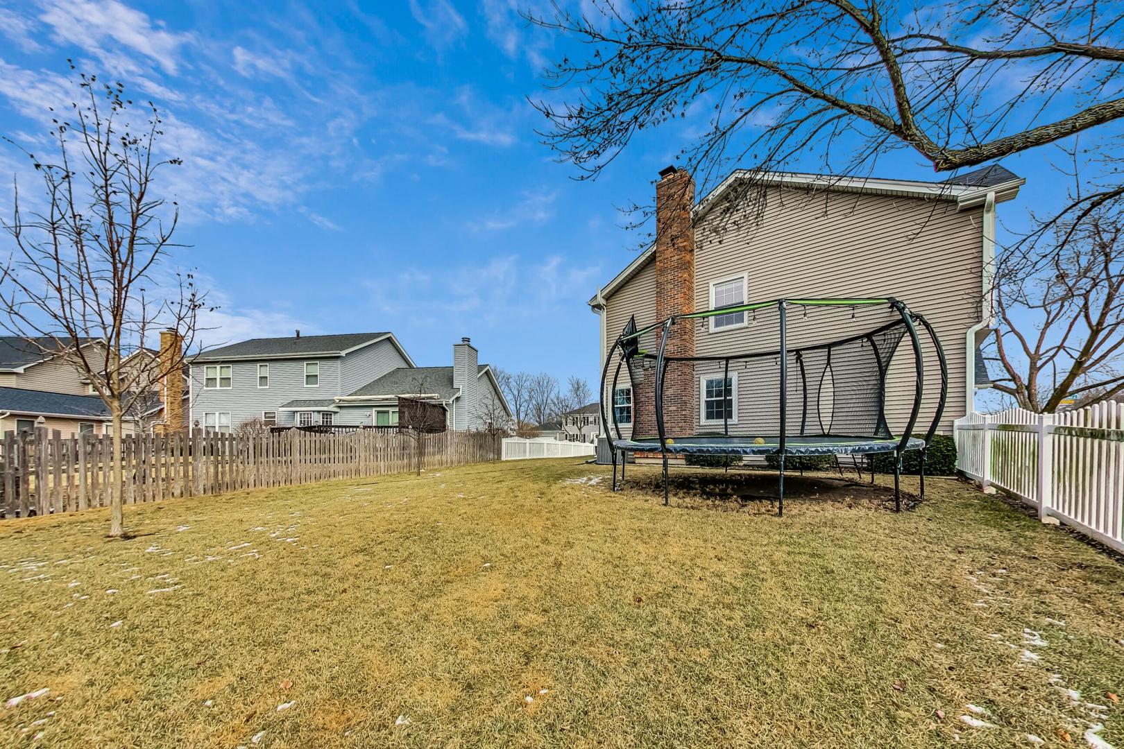 1345 East Bailey Road Naperville, IL 60565 - Photo 37 of 49 a view of a house with a yard