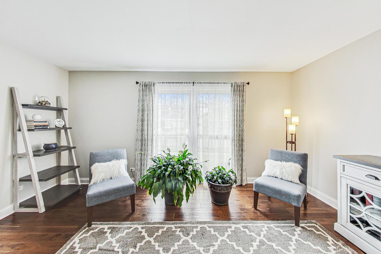 1345 East Bailey Road Naperville, IL 60565 - Photo 4 of 49 a living room with furniture and a potted plant