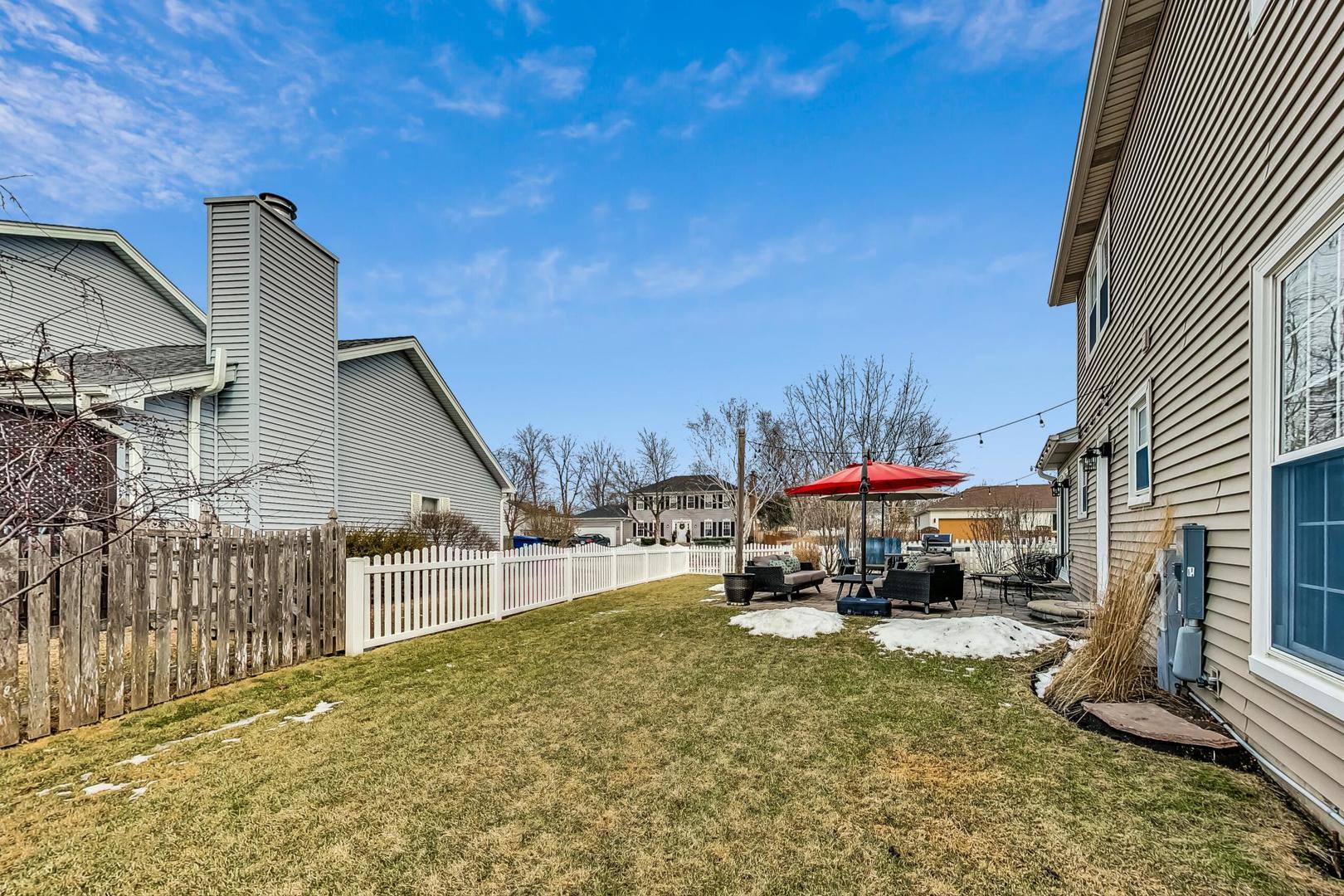 1345 East Bailey Road Naperville, IL 60565 - Photo 41 of 49 a car parked in front of a house