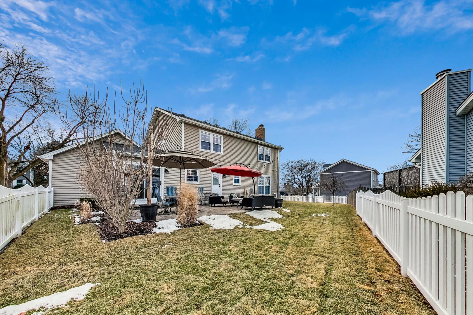 1345 East Bailey Road Naperville, IL 60565 - Photo 42 of 49 a view of a house with wooden fence