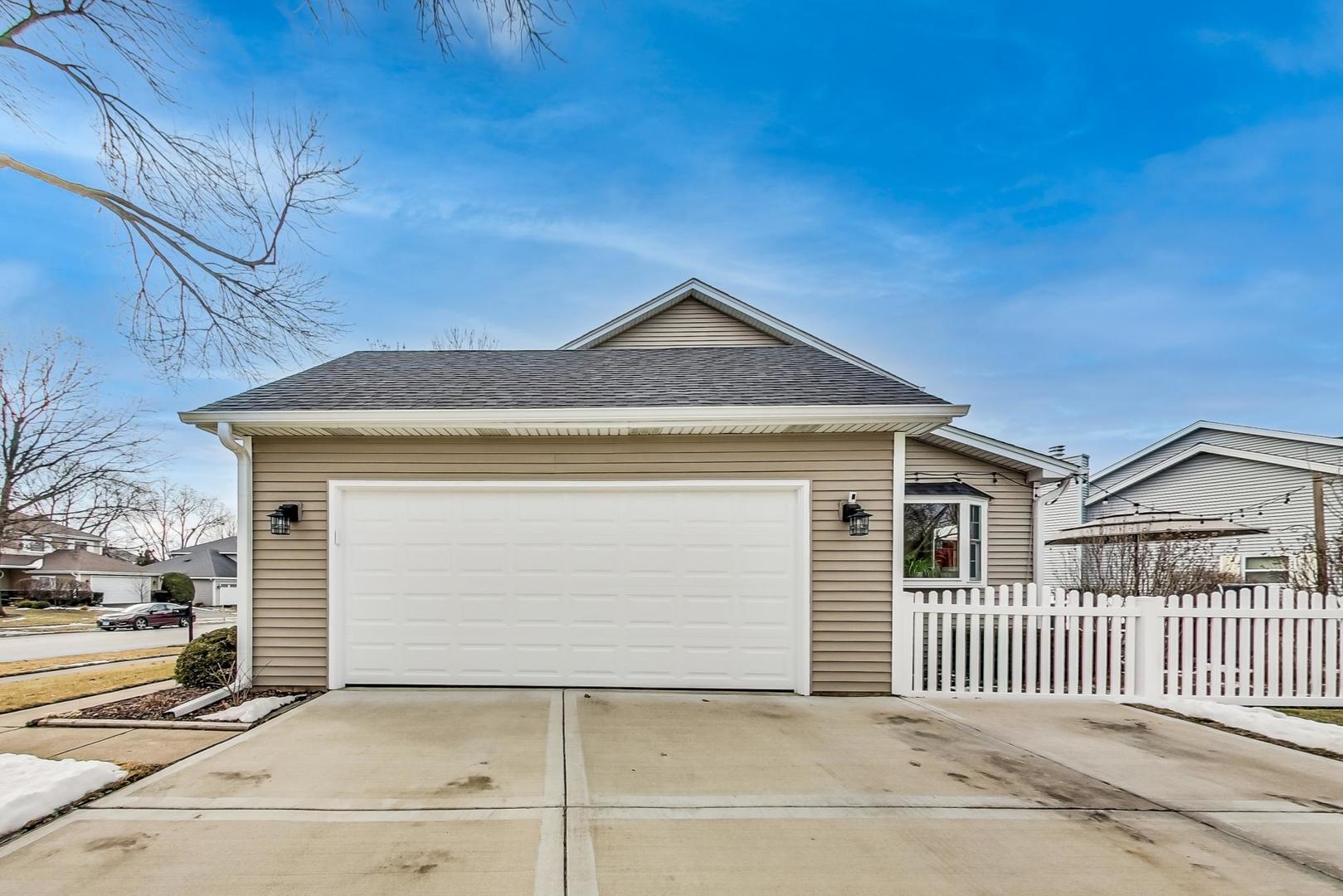 1345 East Bailey Road Naperville, IL 60565 - Photo 43 of 49 a front view of a house with a garage