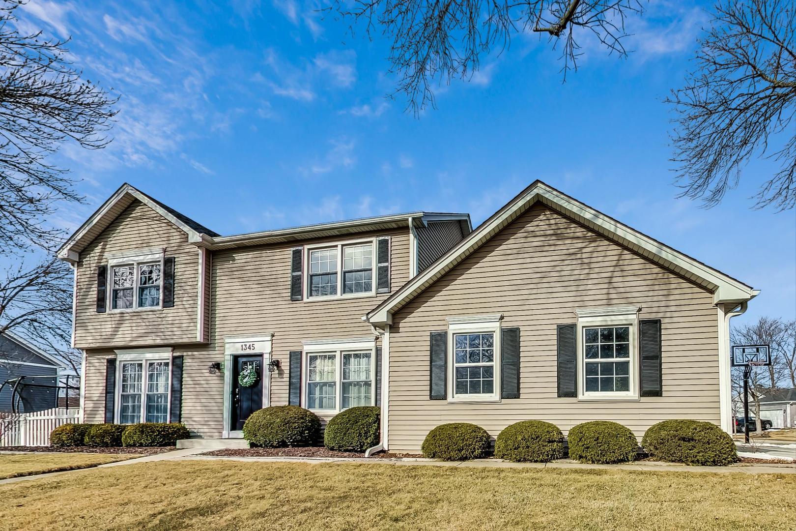 1345 East Bailey Road Naperville, IL 60565 - Photo 46 of 49 a front view of a house with a yard