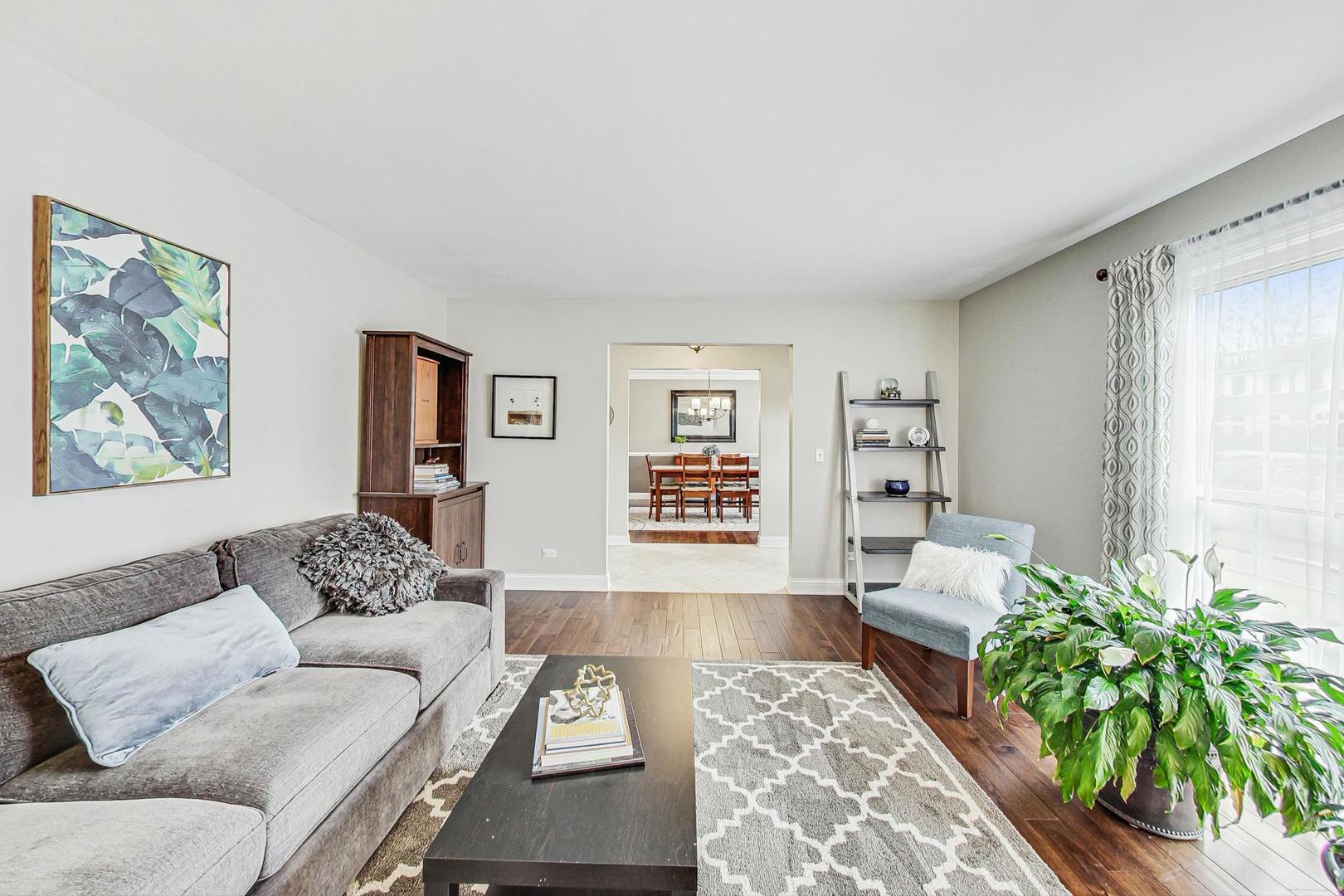 1345 East Bailey Road Naperville, IL 60565 - Photo 5 of 49 a living room with furniture and a potted plant