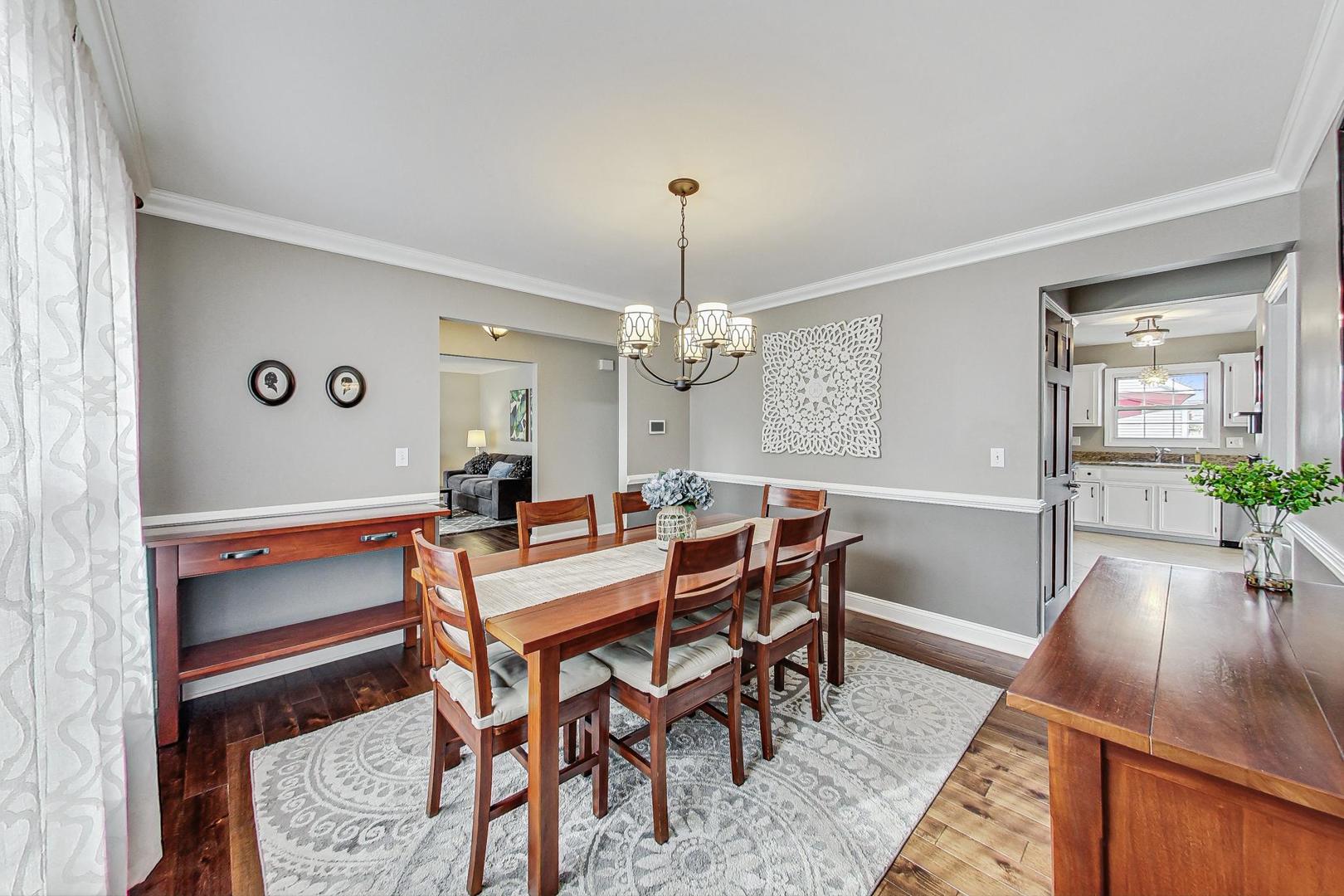 1345 East Bailey Road Naperville, IL 60565 - Photo 7 of 49 a view of a dining room with furniture and wooden floor