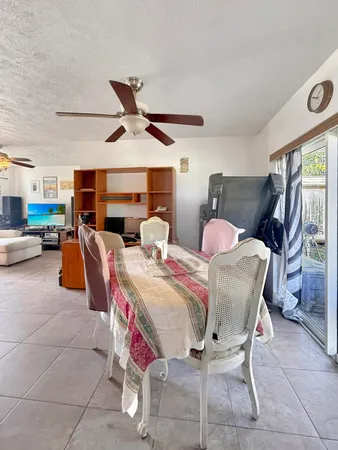 a living room with furniture a window and a chandelier