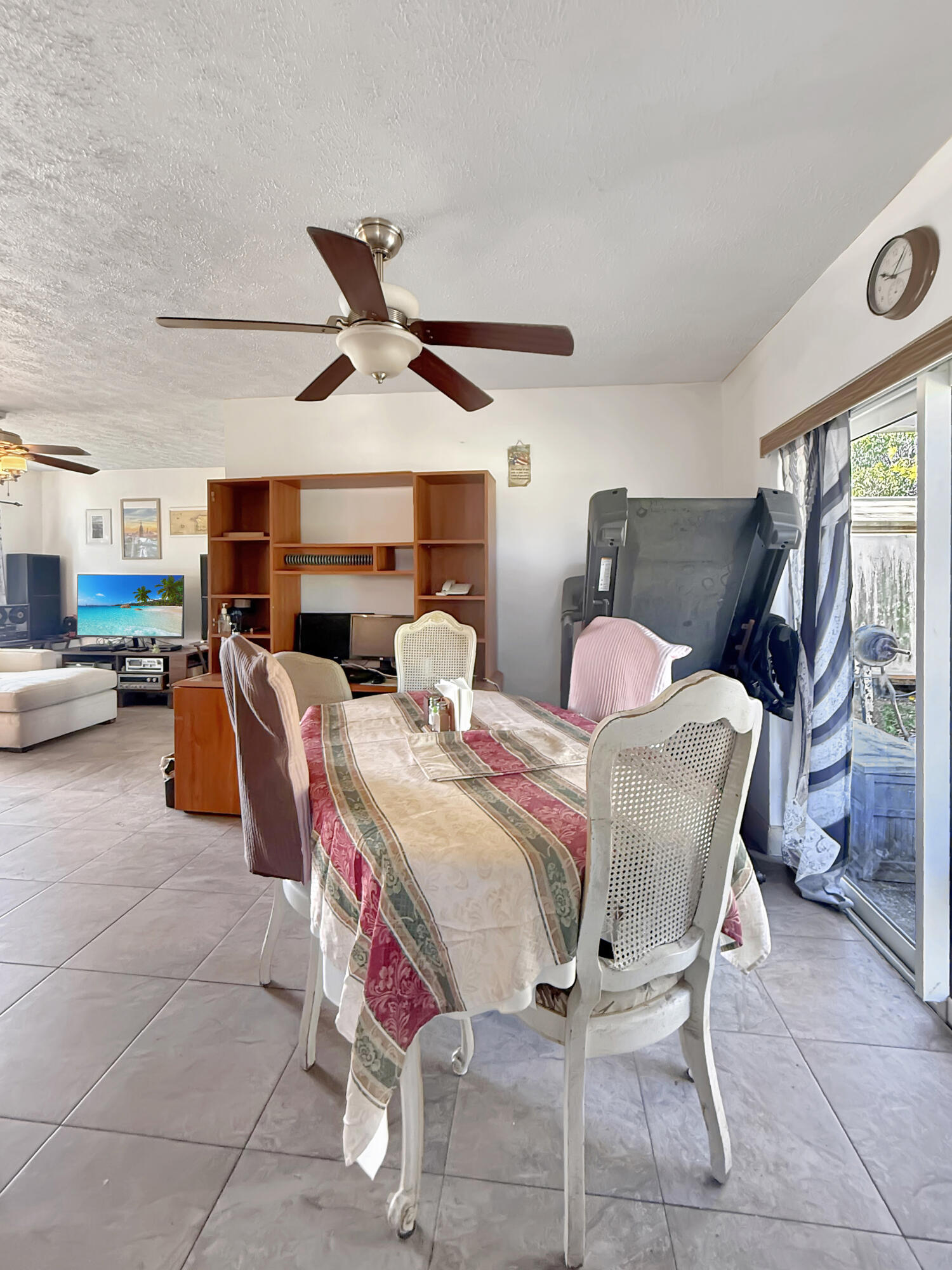 14314 Southwest 109th Court Miami, FL 33176 - Photo 12 of 15 a living room with furniture a window and a chandelier
