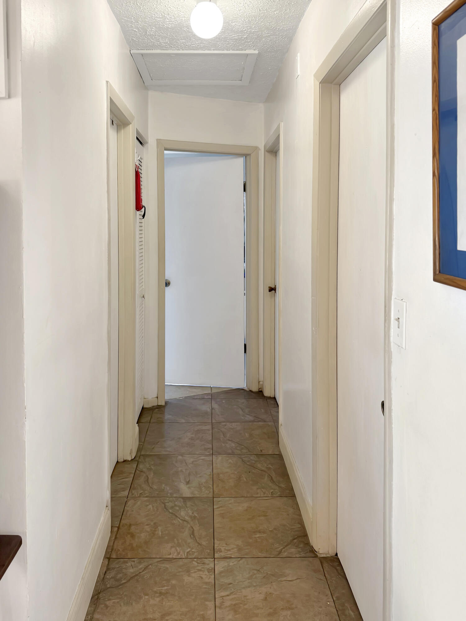 14314 Southwest 109th Court Miami, FL 33176 - Photo 13 of 15 a view of a hallway with a door