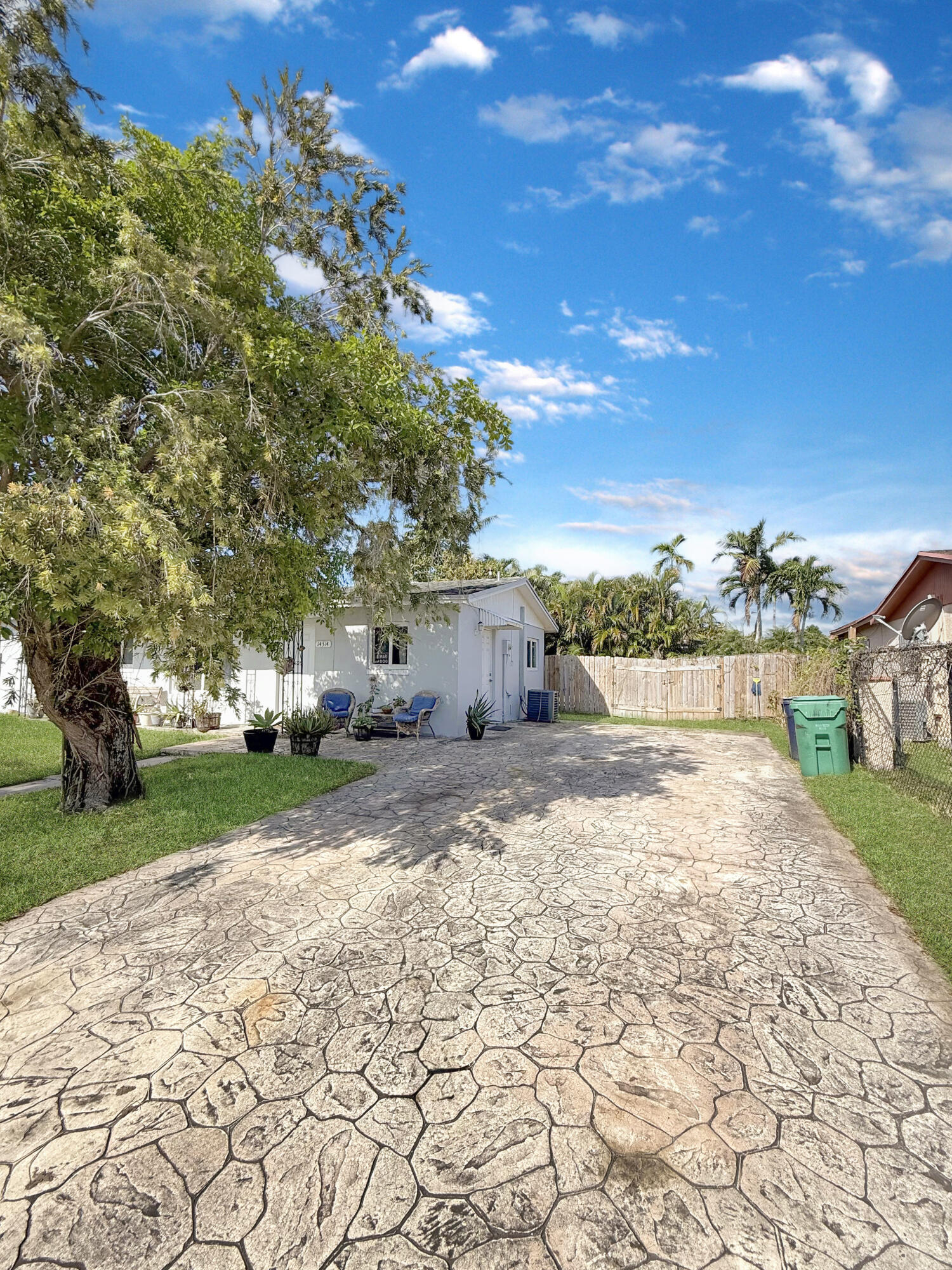14314 Southwest 109th Court Miami, FL 33176 - Photo 3 of 15 a street view with a yard
