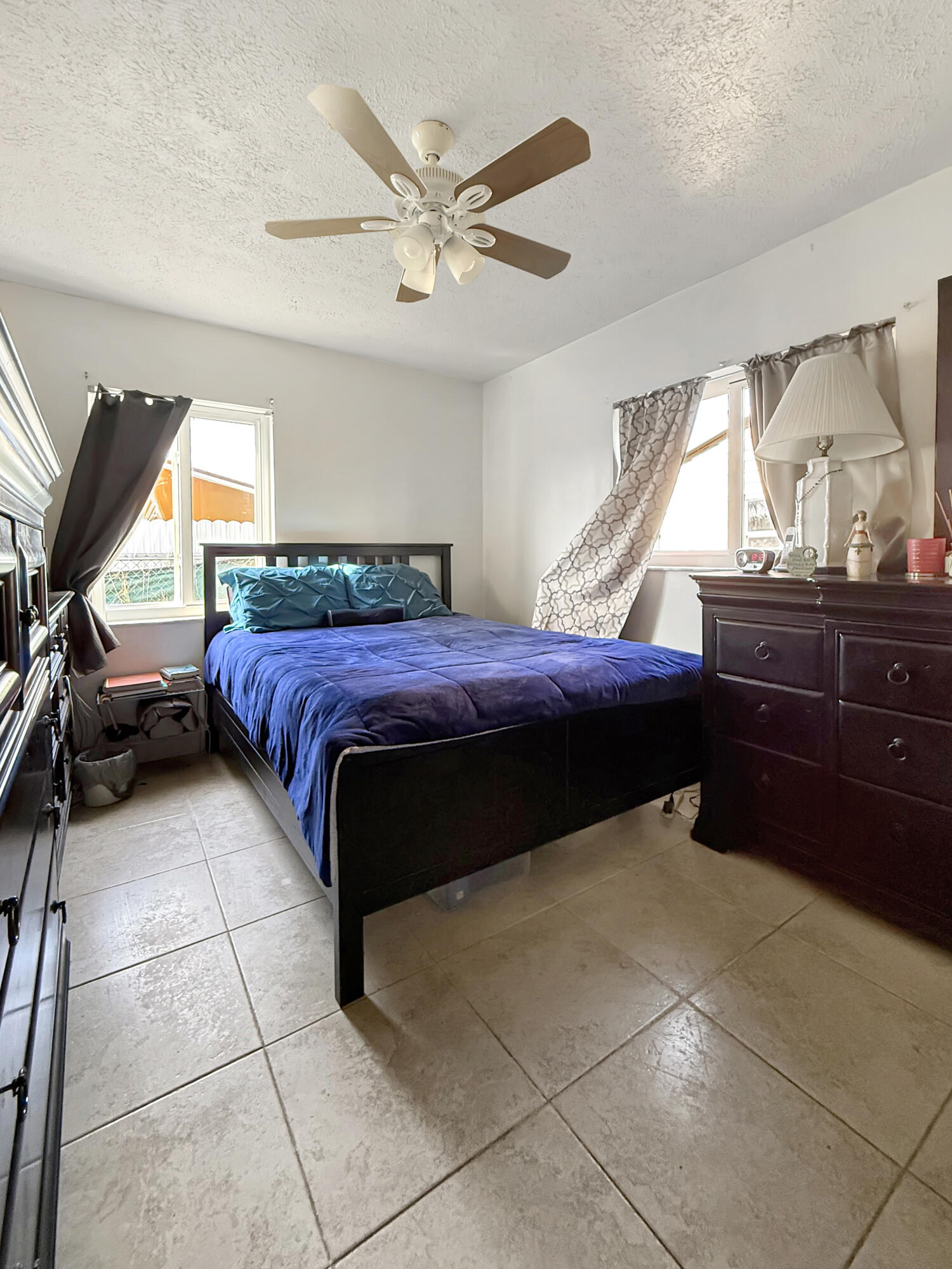 14314 Southwest 109th Court Miami, FL 33176 - Photo 10 of 15 a bedroom with a bed and window