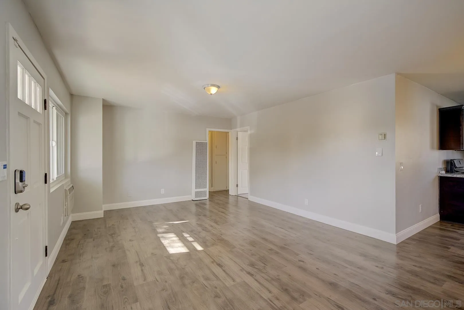 9060 Rosedale Drive Spring Valley, CA 91977 - Photo 16 of 28 a view of empty room with wooden floor