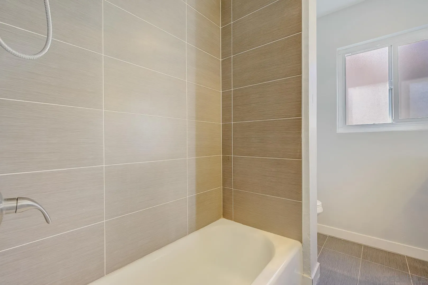 9060 Rosedale Drive Spring Valley, CA 91977 - Photo 24 of 28 a bathroom with a bath tub