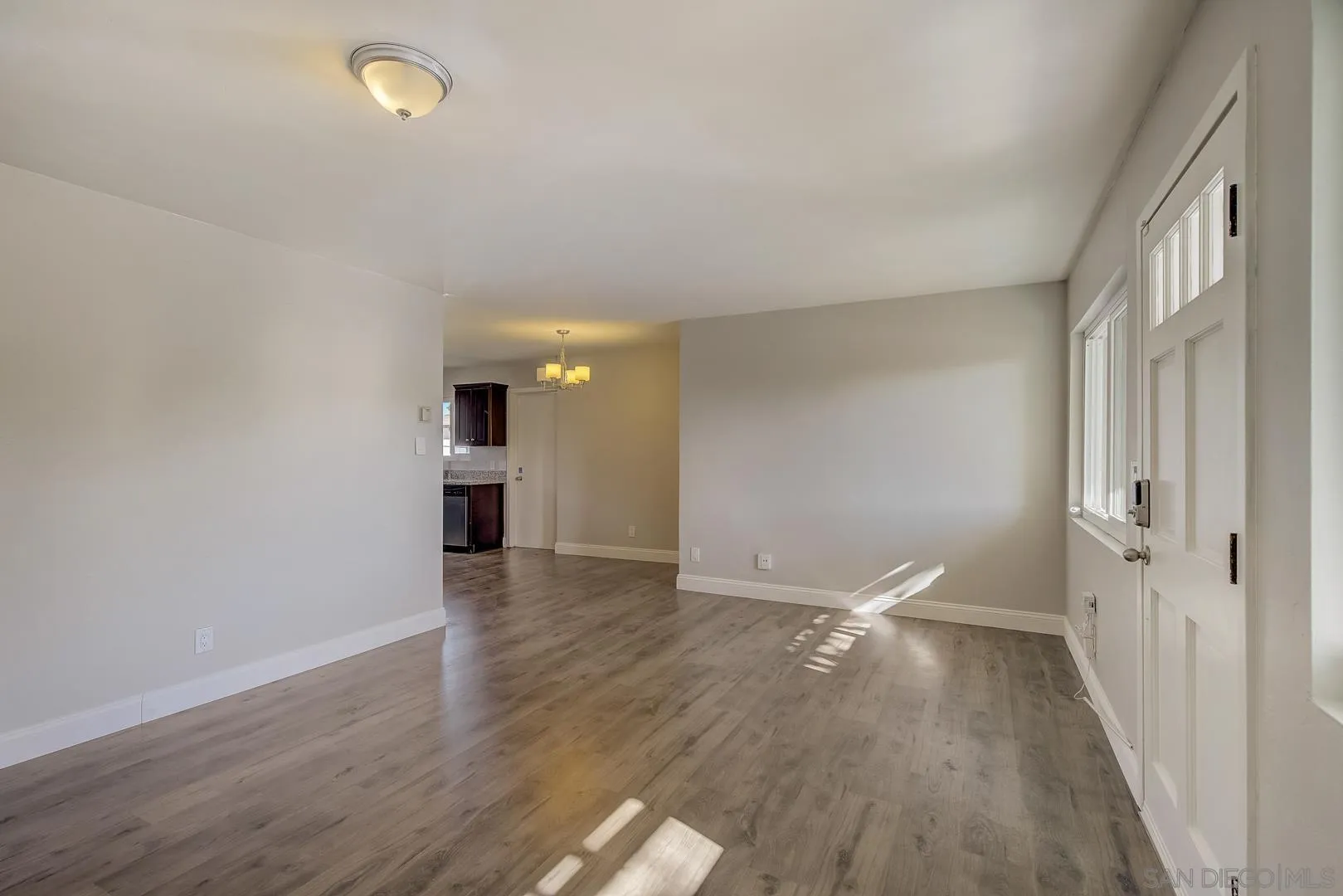 9060 Rosedale Drive Spring Valley, CA 91977 - Photo 5 of 28 a view of an empty room with wooden floor