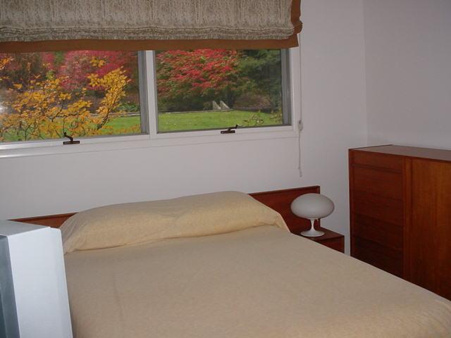14 Averic Road Stockbridge, MA 01266 - Photo 11 of 16 a room with a bed and a painting on the wall