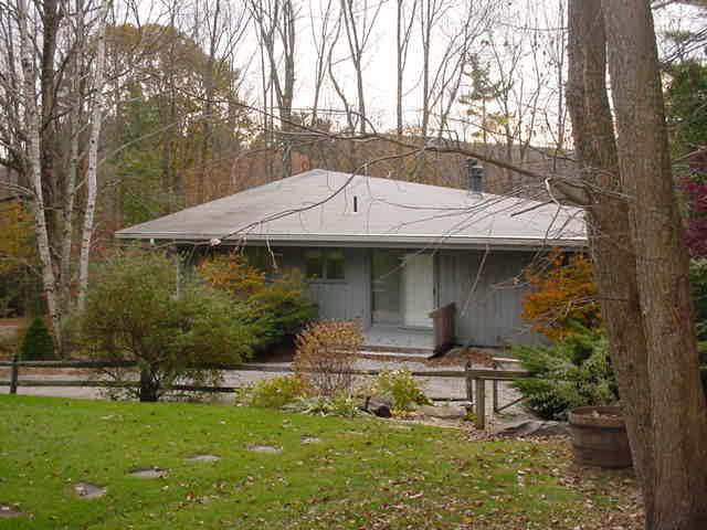 14 Averic Road Stockbridge, MA 01266 - Photo 4 of 16 a view of a yard with a small cabin