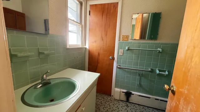 a bathroom with a sink and mirror