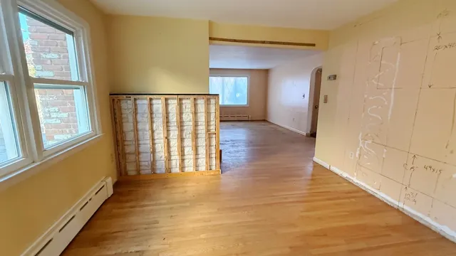 a view of entryway with wooden floor