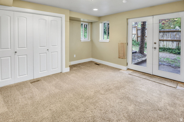 1320 Canyon Park Road Bountiful, UT 84010 - Photo 18 of 28 Unfurnished bedroom with french doors, light colored carpet, access to outside, a closet, and recessed lighting