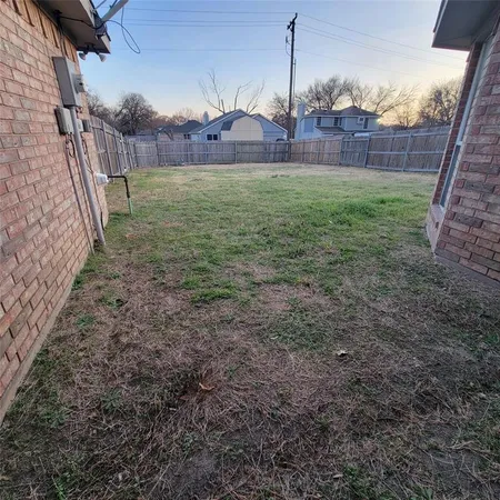 a view of a barn in the middle of a yard