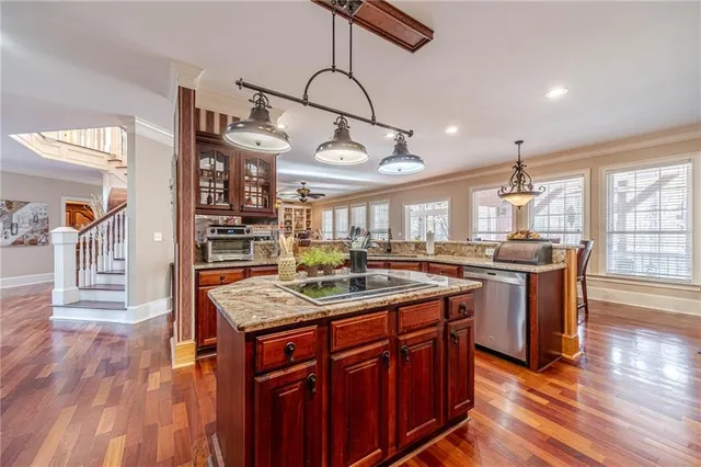 a large bathroom with a large mirror vanity and a sink