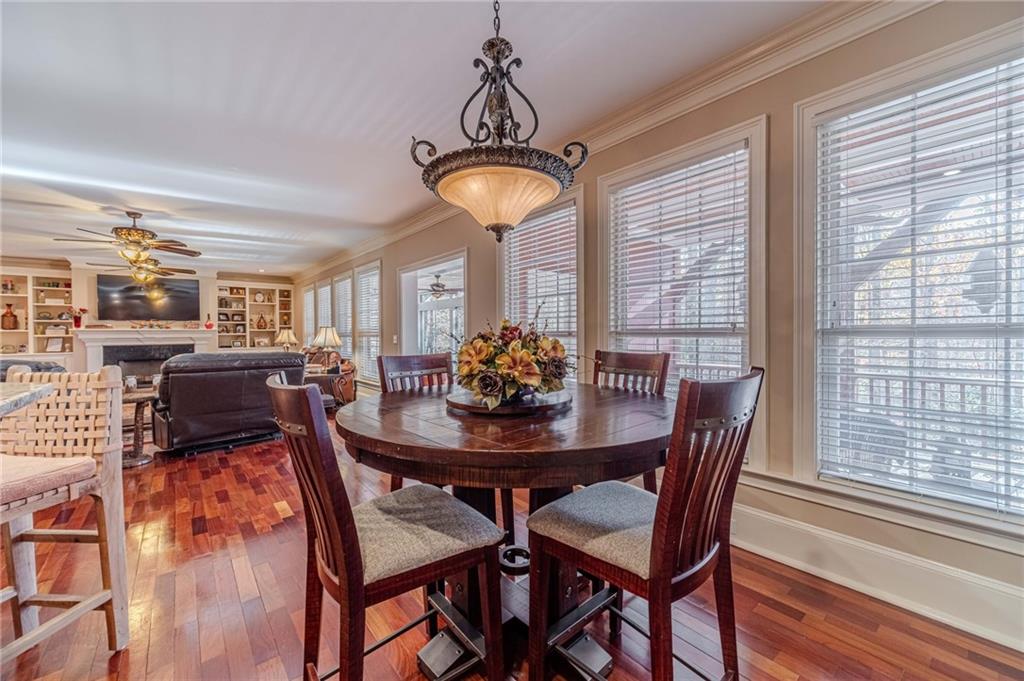 686 Newton Factory Bridge Road Covington, GA 30014 - Photo 16 of 110 a view of a dining room with furniture window and wooden floor