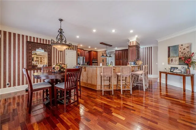 a bedroom with furniture and a potted plant