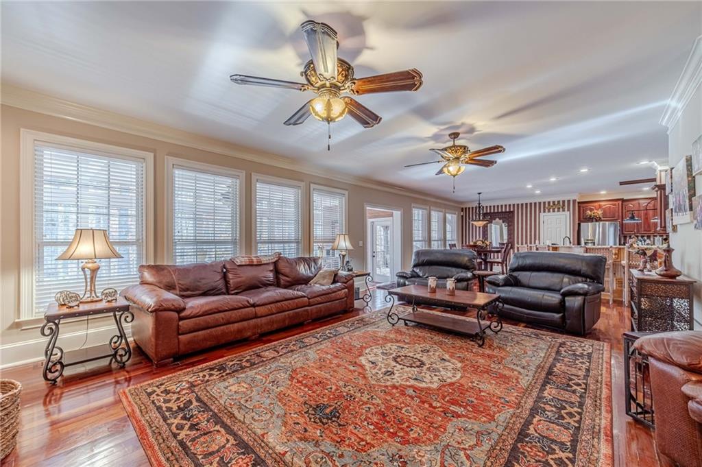 686 Newton Factory Bridge Road Covington, GA 30014 - Photo 20 of 110 a living room with furniture and a chandelier
