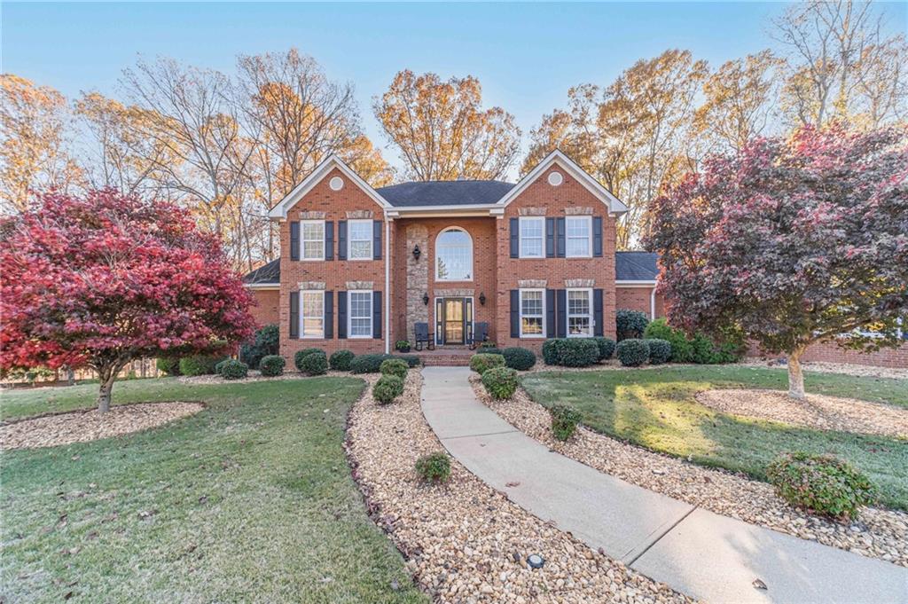 686 Newton Factory Bridge Road Covington, GA 30014 - Photo 2 of 110 a front view of a house with a yard and garage