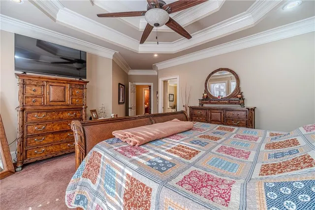 a bathroom with a granite countertop shower a mirror and a sink