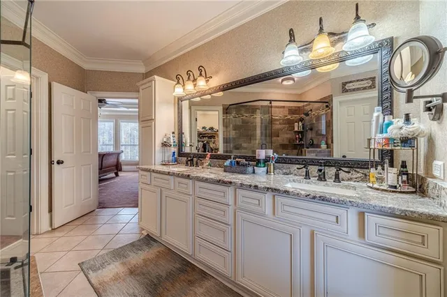 a living room with furniture a flat screen tv and a large window