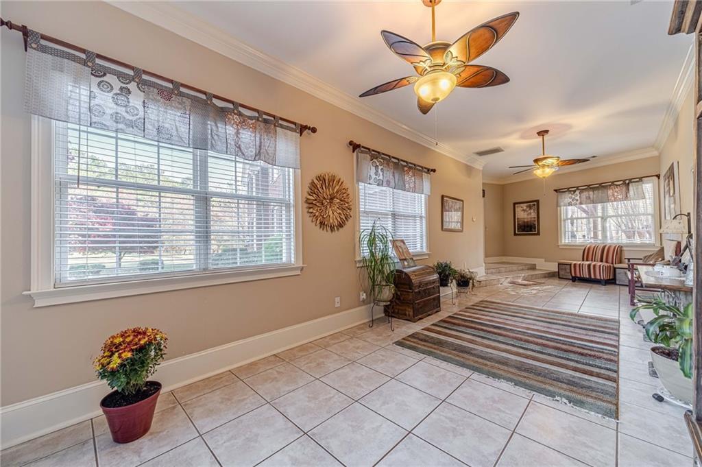 686 Newton Factory Bridge Road Covington, GA 30014 - Photo 36 of 110 a bedroom with furniture and a potted plant
