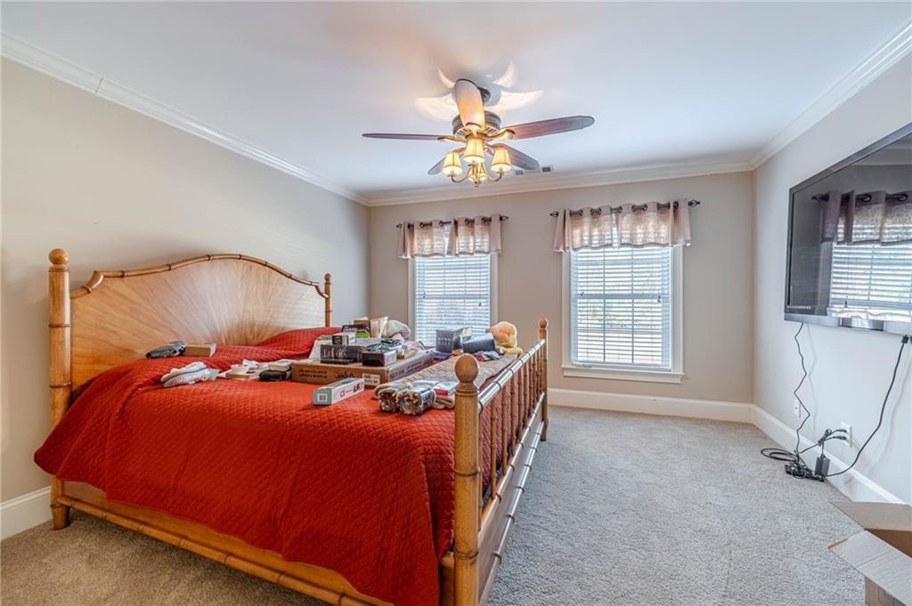 686 Newton Factory Bridge Road Covington, GA 30014 - Photo 39 of 110 a bed room with a bed and a window