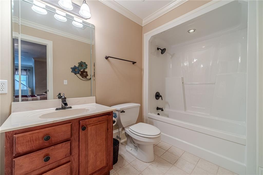 686 Newton Factory Bridge Road Covington, GA 30014 - Photo 44 of 110 a bathroom with a sink a toilet and shower