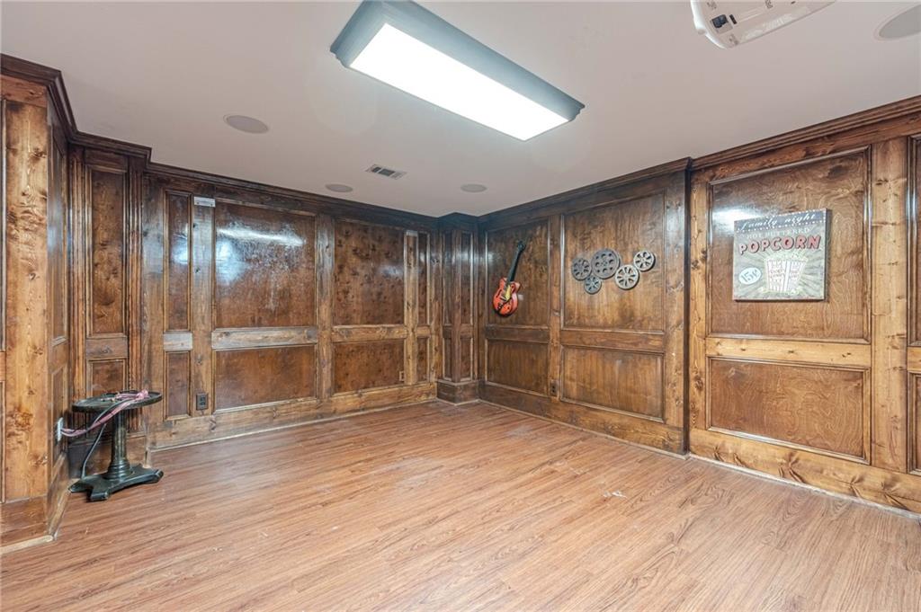 686 Newton Factory Bridge Road Covington, GA 30014 - Photo 48 of 110 a view of empty room with wooden floor and fan