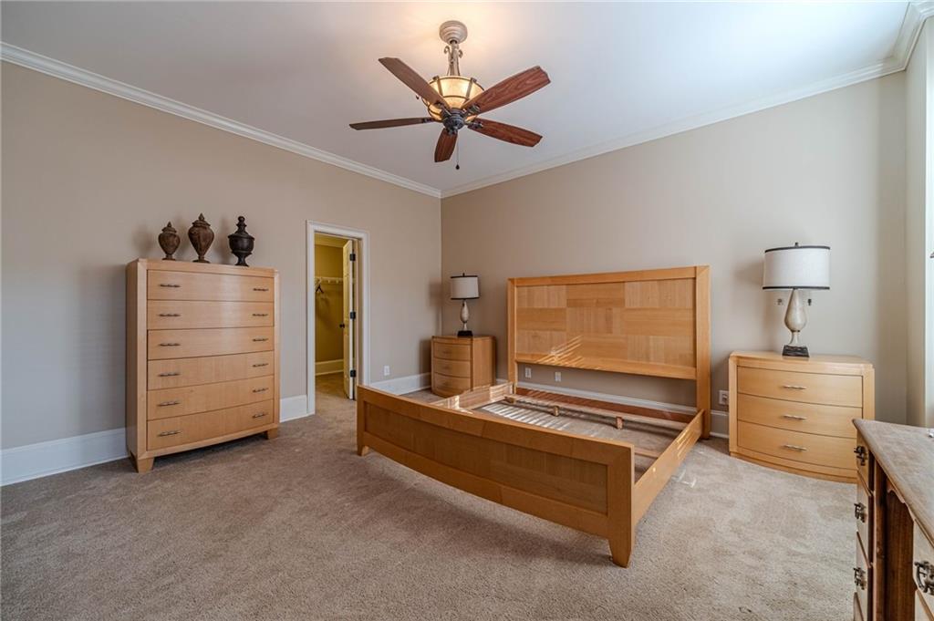 686 Newton Factory Bridge Road Covington, GA 30014 - Photo 57 of 110 a living room with furniture and a ceiling fan