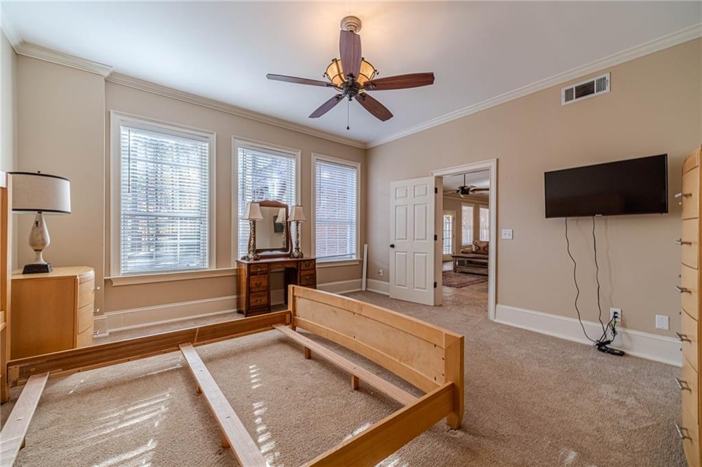 686 Newton Factory Bridge Road Covington, GA 30014 - Photo 58 of 110 a living room with furniture and a flat screen tv
