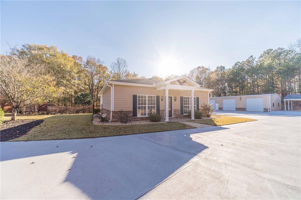 686 Newton Factory Bridge Road Covington, GA 30014 - Photo 63 of 110 a view of a house with swimming pool and sitting area