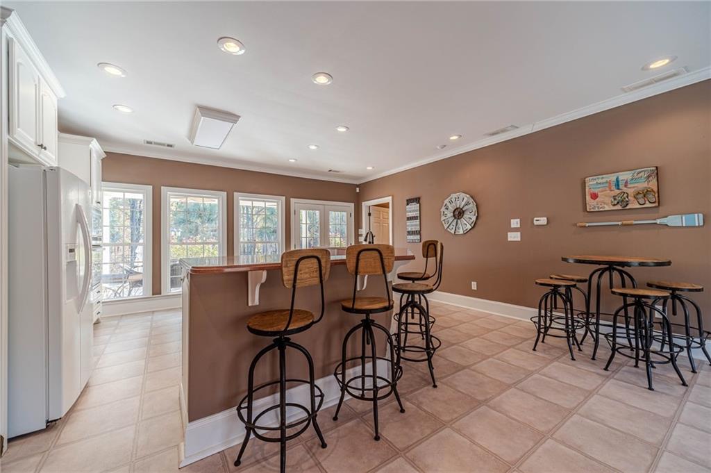 686 Newton Factory Bridge Road Covington, GA 30014 - Photo 66 of 110 a view of a dining room with furniture window and outside view