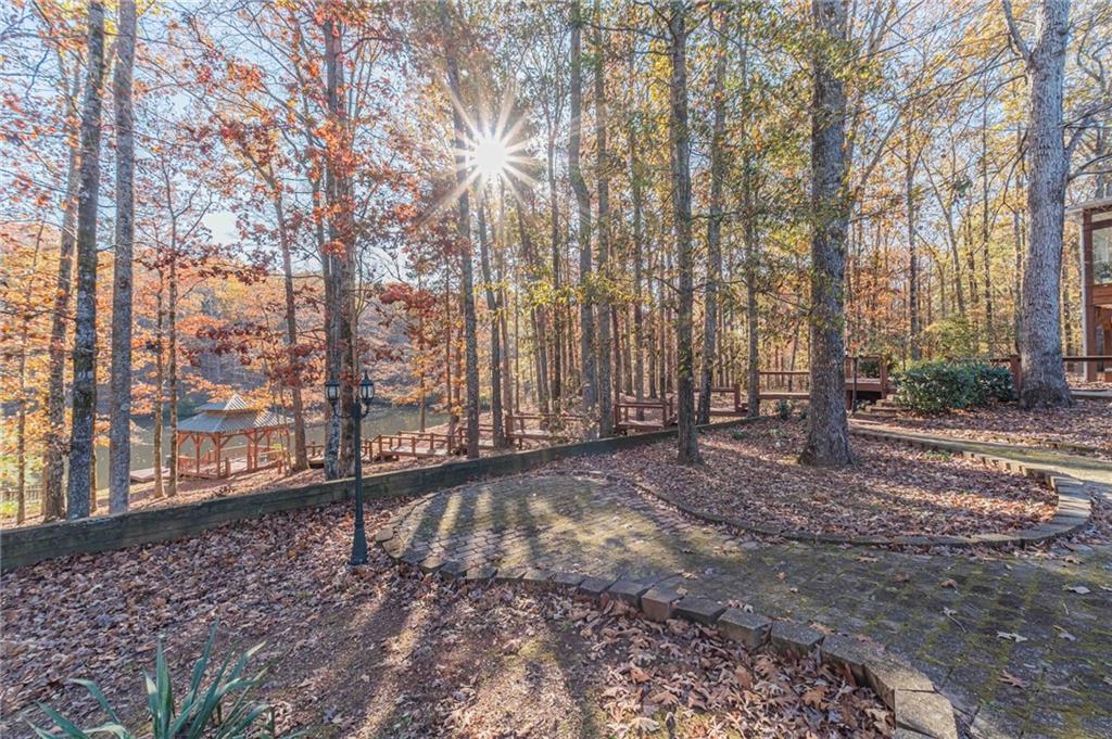 686 Newton Factory Bridge Road Covington, GA 30014 - Photo 97 of 110 a view of a yard with large trees