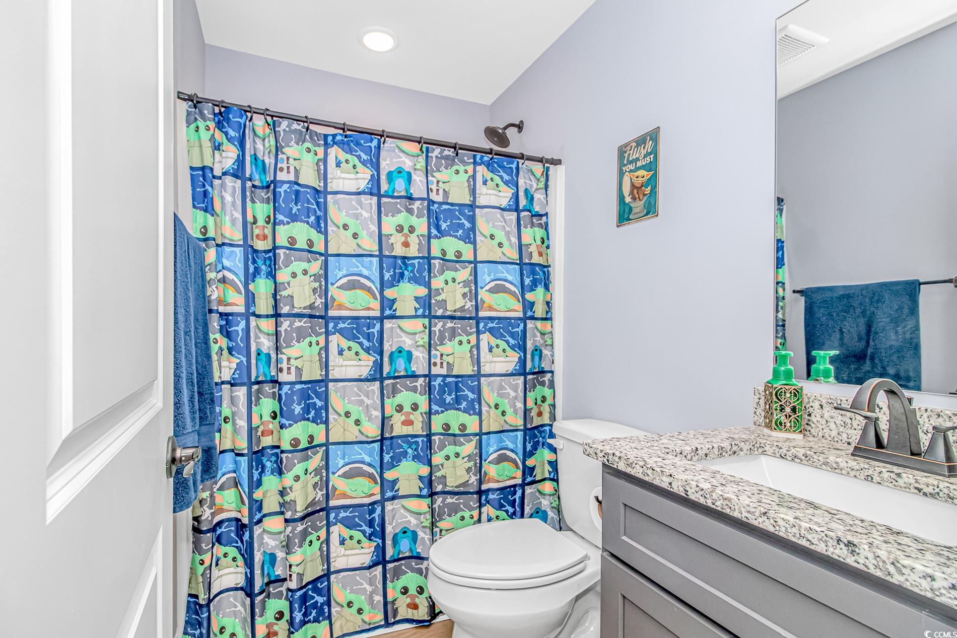 4082 Edwards Road Aynor, SC 29511 - Photo 14 of 40 Bathroom with vanity and a shower with curtain