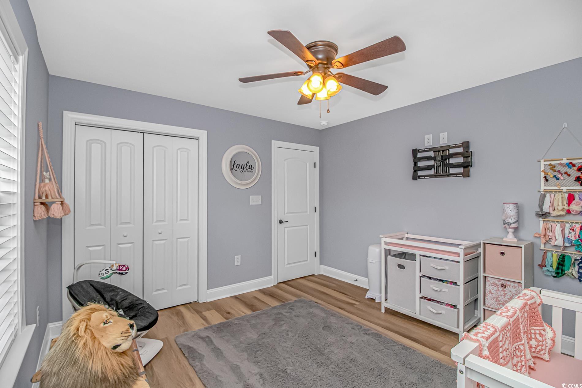 4082 Edwards Road Aynor, SC 29511 - Photo 16 of 40 Bedroom with ceiling fan, light wood-style floors, and a closet