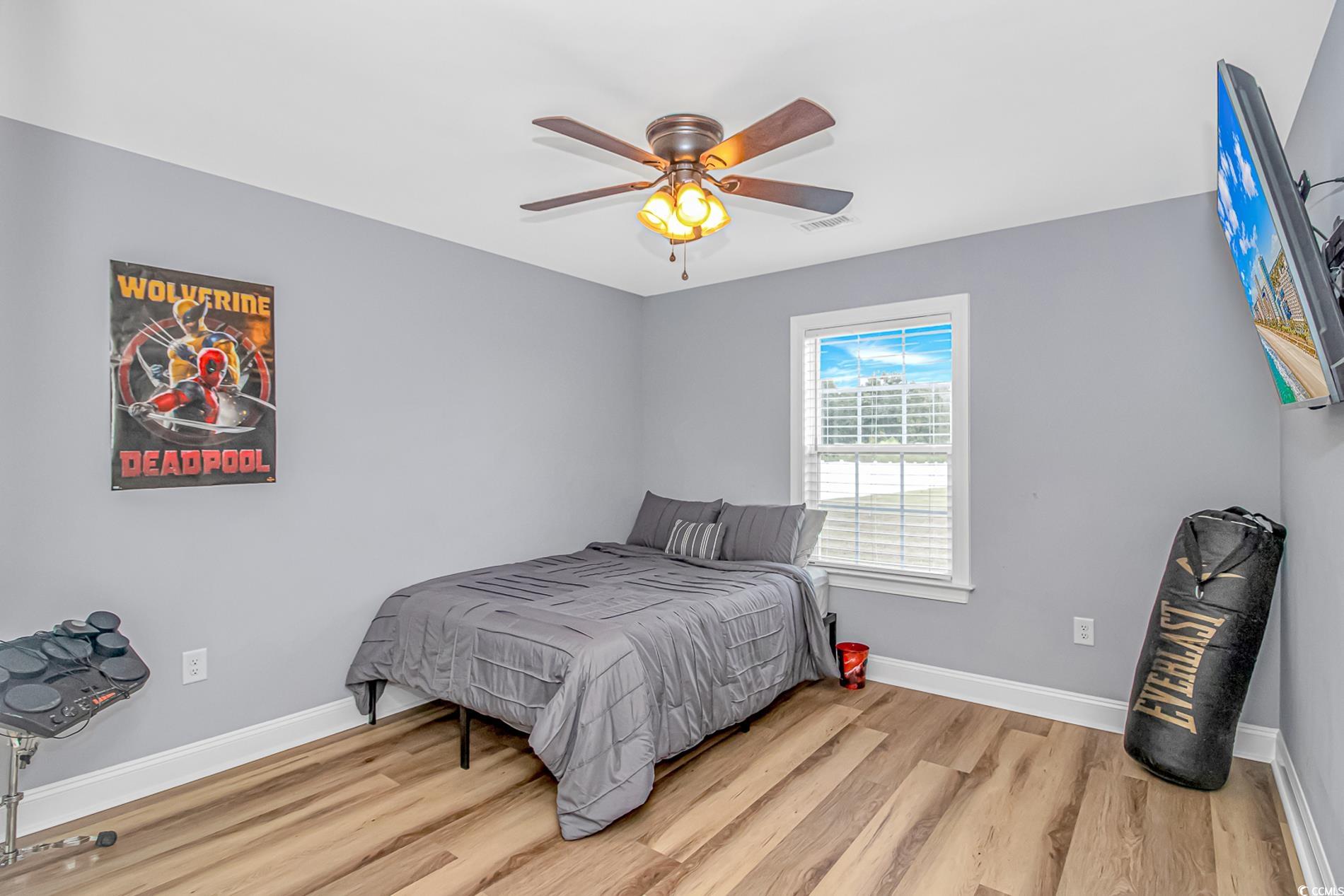 4082 Edwards Road Aynor, SC 29511 - Photo 18 of 40 Bedroom with light wood-type flooring and ceiling fan