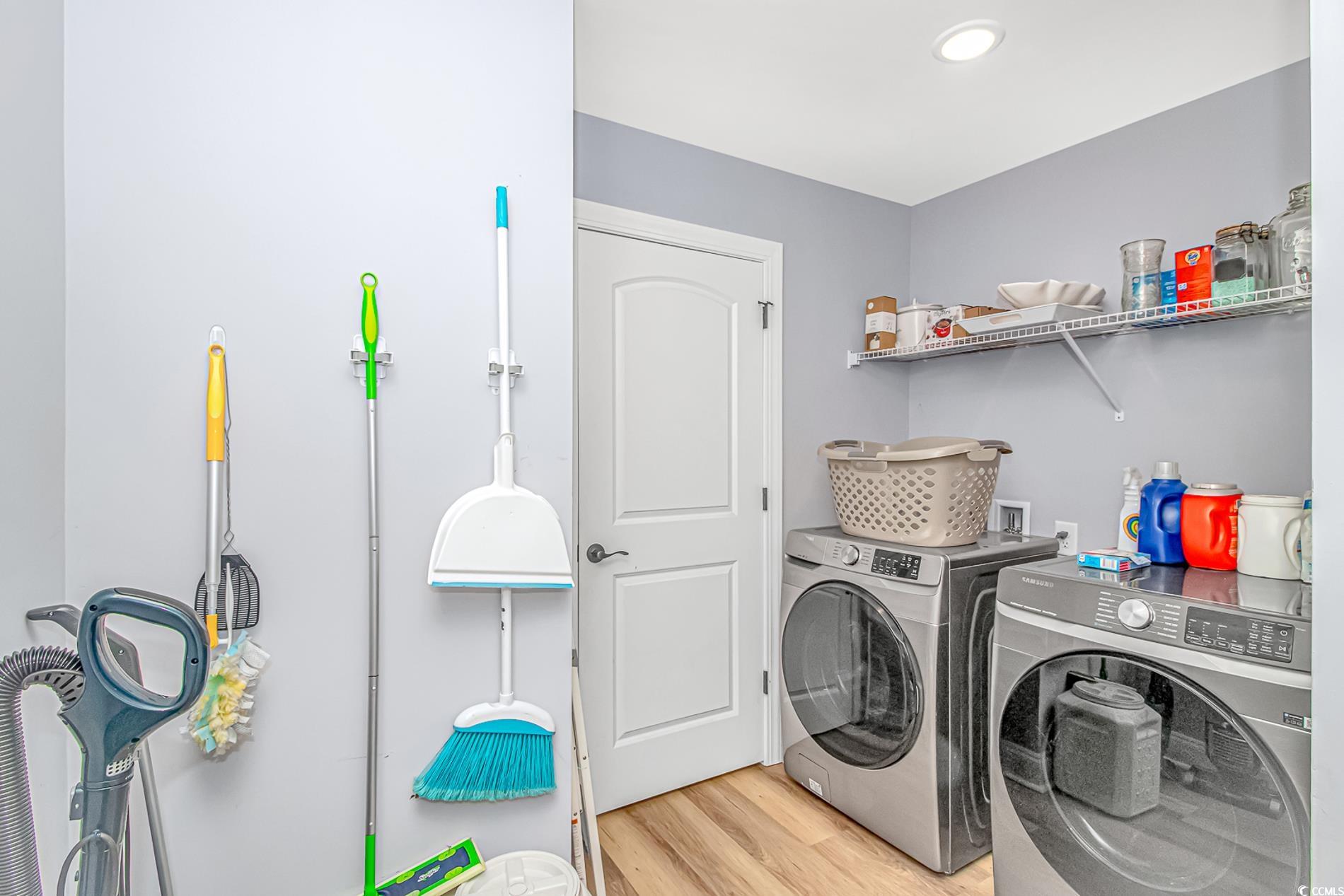 4082 Edwards Road Aynor, SC 29511 - Photo 25 of 40 Laundry room with light wood-style floors and washing machine and clothes dryer