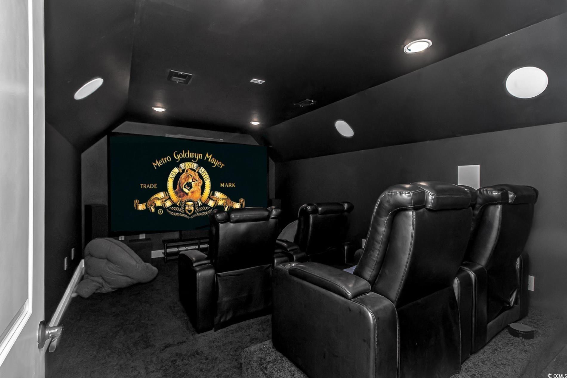 4082 Edwards Road Aynor, SC 29511 - Photo 27 of 40 Carpeted home theater room with vaulted ceiling