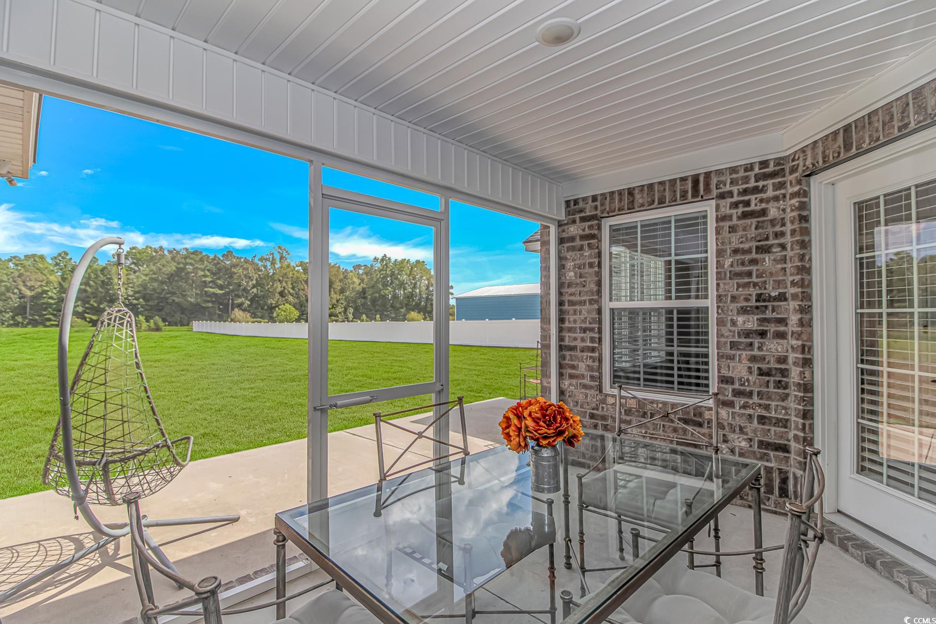 4082 Edwards Road Aynor, SC 29511 - Photo 29 of 40 Unfurnished sunroom with a patio area