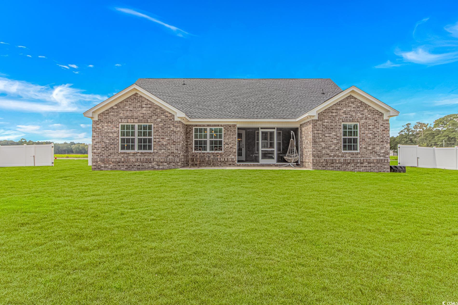4082 Edwards Road Aynor, SC 29511 - Photo 30 of 40 Back of house featuring brick siding, a patio, and roof with shingles