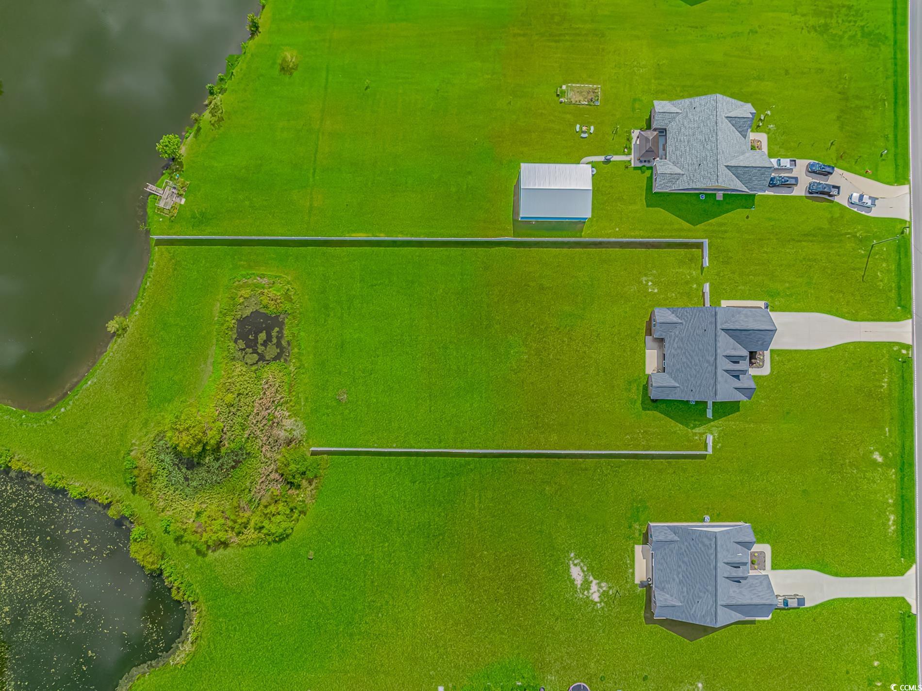 4082 Edwards Road Aynor, SC 29511 - Photo 38 of 40 Drone / aerial view of a nearby body of water